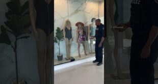 Woman-hide-herself-in-mannequin-display-area-Shorts